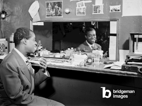Louis Armstrong in a dressing room at Aquarium in New York City 